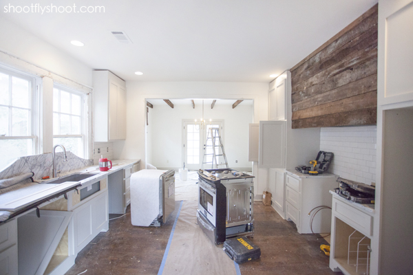 Ashley Gilbreath Kitchen | Revere Pewter Cabinets | White Dove Walls | Rustic Wood Range Hood