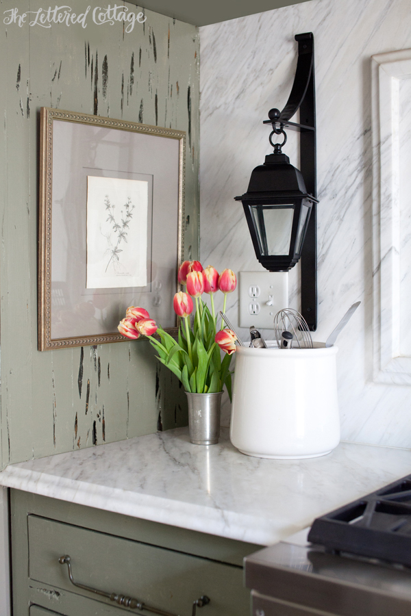 Marble Countertop | Lantern Sconce | Green Cypress Kitchen Cabinets | Tulips | Framed Botanical Print