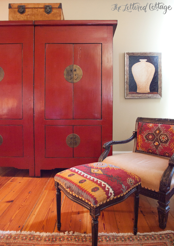 Red Armoire | Rug Covered Chair and Ottoman