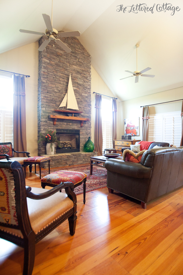 Stone Fireplace | Tall Ceiling | Red Living Room | Pine Floor
