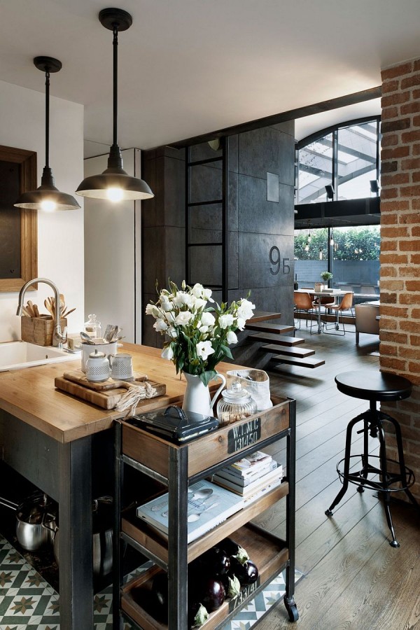 Custom-crafted-concrete-panels-brick-wall-and-lighting-add-industrial-charm-to-the-apartment